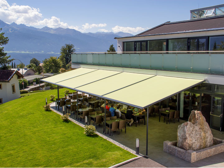 Image of multiple pergolas fitted outside classrooms to provide a sheltered outdoor area.